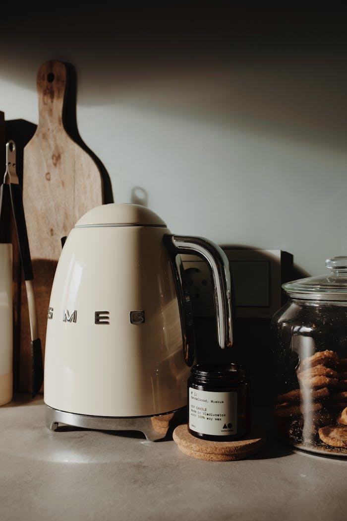 services-06 Warm kitchen scene featuring a retro kettle, cookies, and stylish kitchenware.